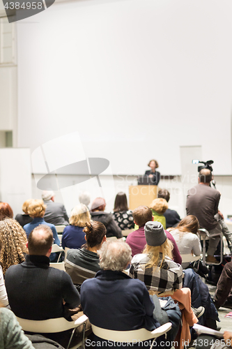 Image of Woman giving presentation on business conference.