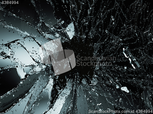 Image of Pieces of shattered or smashed glass on black