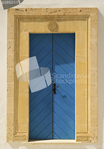 Image of Old Blue door with arch from Tunisia