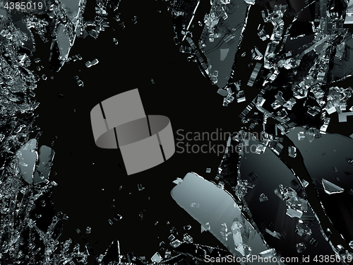 Image of Pieces of splitted or cracked glass on black