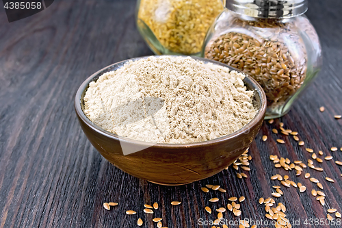 Image of Flour linen in bowl with seeds in glass jars on table