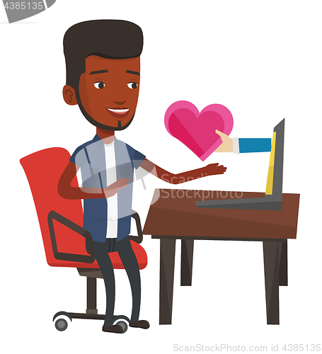 Image of Young man dating online using laptop.