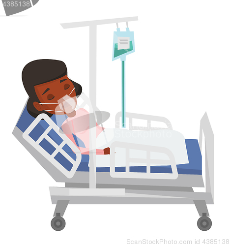 Image of Patient lying in hospital bed with oxygen mask.