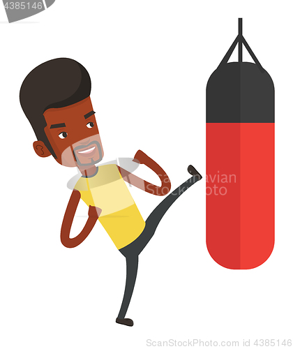 Image of Man exercising with punching bag.