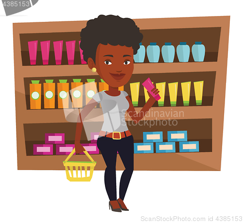 Image of Customer with shopping basket and tube of cream.