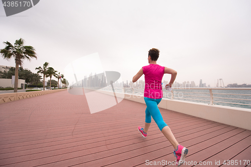 Image of woman running on the promenade