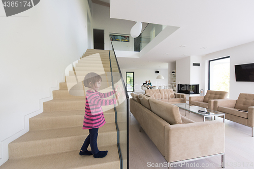 Image of family with little girl enjoys in the modern living room