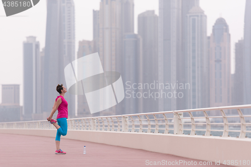 Image of woman stretching and warming up