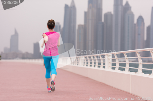 Image of woman running on the promenade