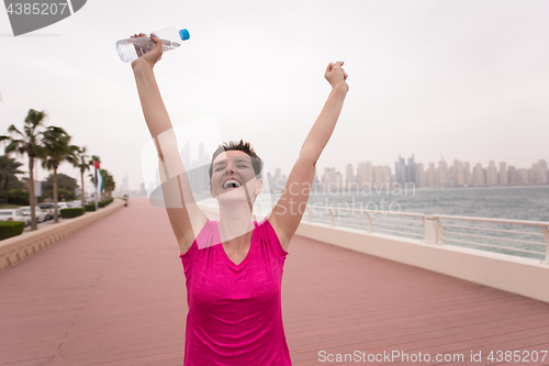 Image of young woman celebrating a successful training run