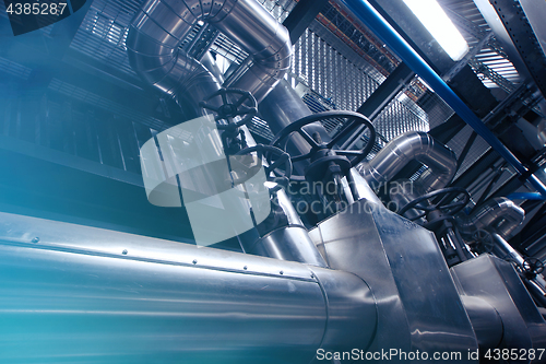 Image of Equipment, cables and piping as found inside of a modern industr