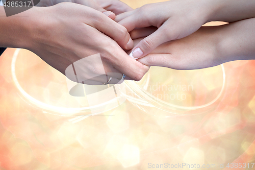 Image of Wedding couple holding hands