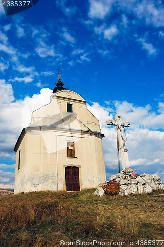 Image of Chapel with cross on hill