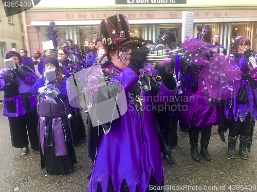 Image of Traditional carnival in South Germany - Swabian-Alemannic Fastnacht. A local group is performing traditional Guggenmusik, brass and percussion music.