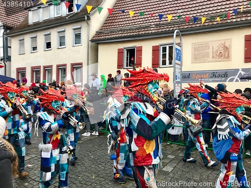 Image of Traditional carnival in South Germany - Swabian-Alemannic Fastnacht. A local group is performing traditional Guggenmusik, brass and percussion music.