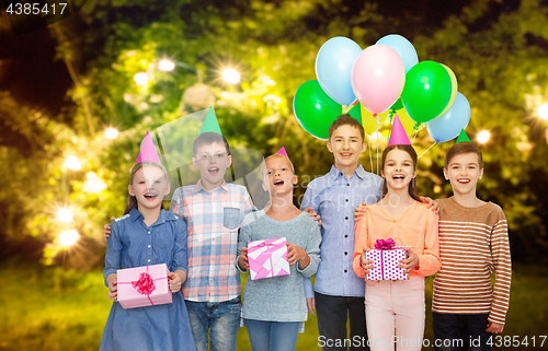 Image of happy children with gifts at birthday party