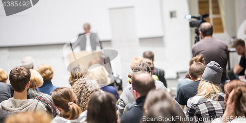 Image of Business speaker giving a talk at business conference event.