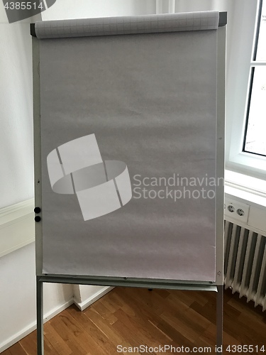 Image of Blank flip chart in the office