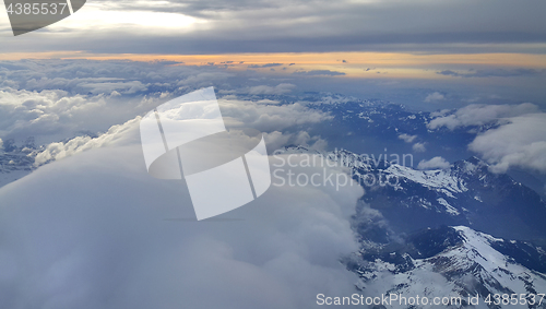 Image of Top view on the Alps, covered with snow and clouds