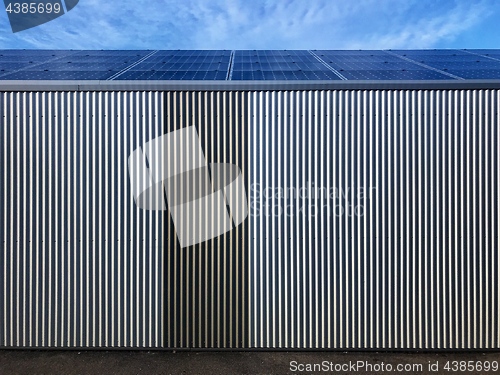 Image of warehouse covered by solar panels