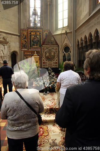 Image of People pray in front of God's tomb on Good Friday in the Zagreb Cathedral