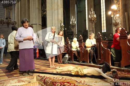 Image of People pray in front of God's tomb on Holy Saturday in the Zagreb Cathedral