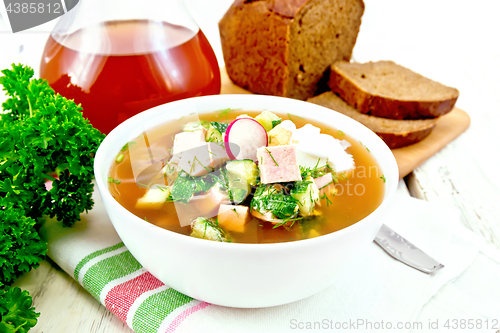 Image of Okroshka in white bowl on towel