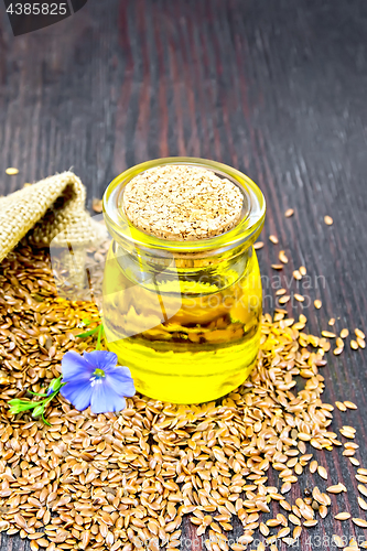 Image of Oil linenseed with flower and seeds on board