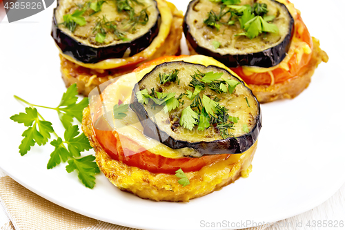 Image of Appetizer of aubergines and cheese in plate on napkin