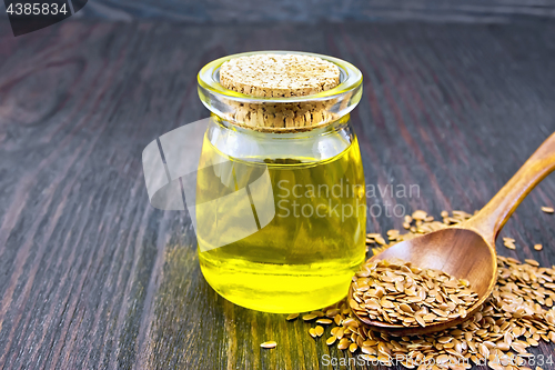 Image of Oil linenseed with spoon on board