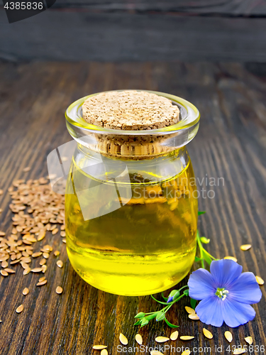 Image of Oil linenseed with flower on board