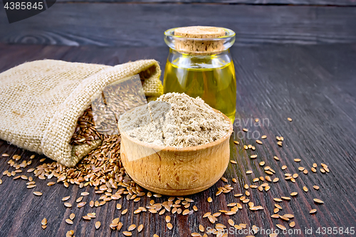 Image of Flour linen in bowl with oil and seeds on board