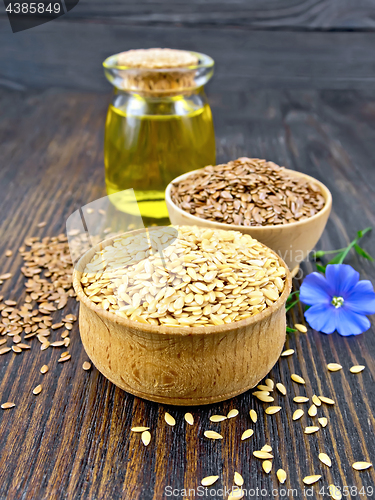 Image of Flaxen white and brown seed in bowl with oil on board