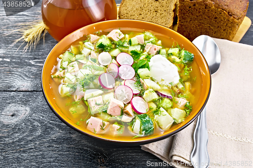 Image of Okroshka in bowl with napkin on black board