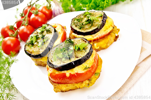 Image of Appetizer of aubergines and cheese in plate on board