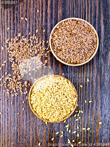 Image of Flaxen white and brown seed in bowl on board top