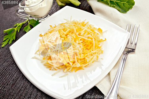 Image of Salad of carrot and kohlrabi in plate on board