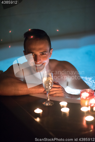 Image of man relaxing in the jacuzzi