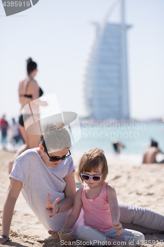 Image of Mom and daughter on the beach