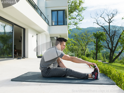 Image of man doing morning yoga exercises