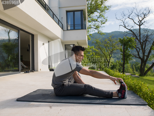 Image of man doing morning yoga exercises