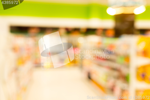 Image of Blur image of aisle in supermarket with customer