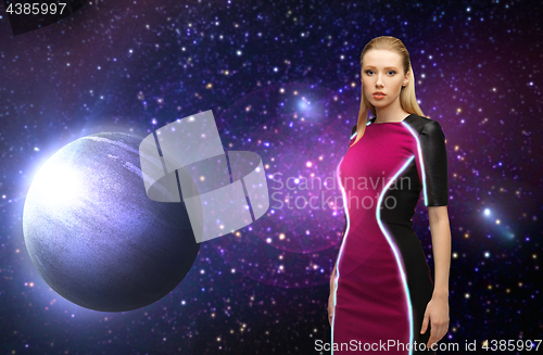 Image of futuristic woman over planet and stars in space