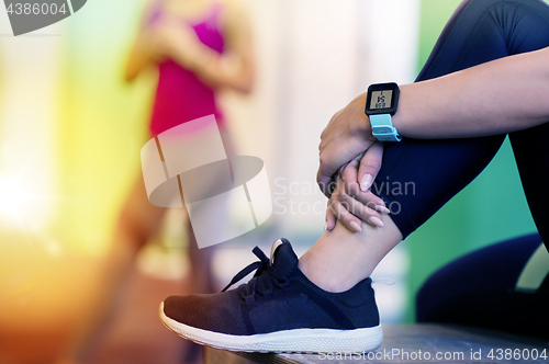 Image of close up of woman with heart rate tracker in gym