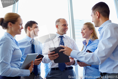 Image of business people with tablet pc computer at office