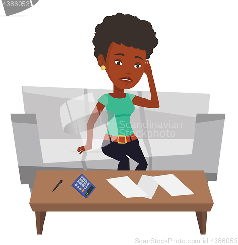 Image of Unhappy african woman accounting home bills.