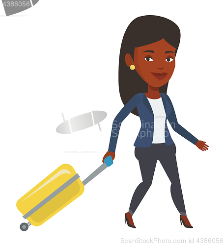 Image of African woman walking with suitcase.