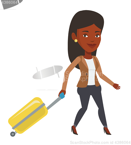 Image of African woman walking with suitcase.