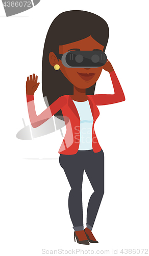 Image of Woman wearing virtual reality headset in the park.