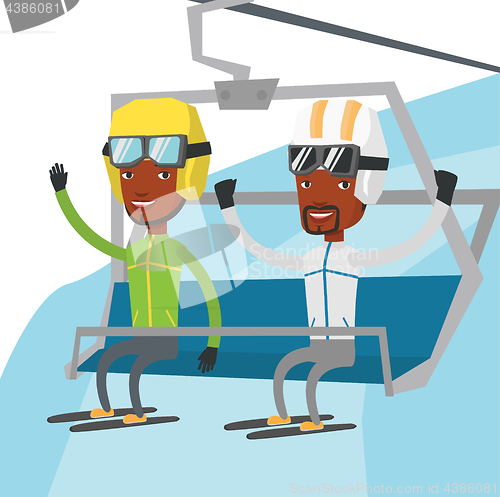 Image of Two happy skiers using cableway at ski resort.